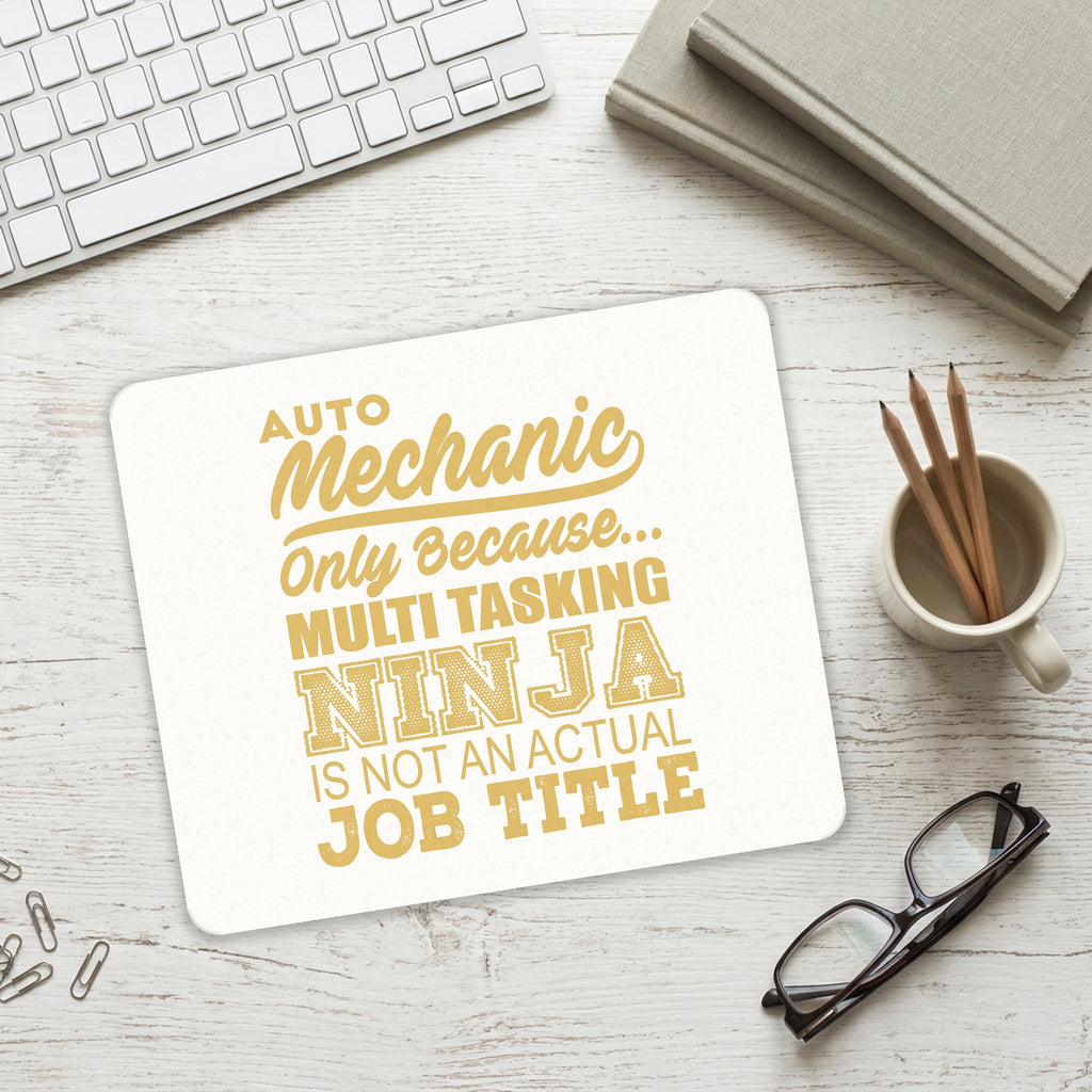 Auto Mechanic Multi Tasking Ninja mouse pad on a desk with a keyboard