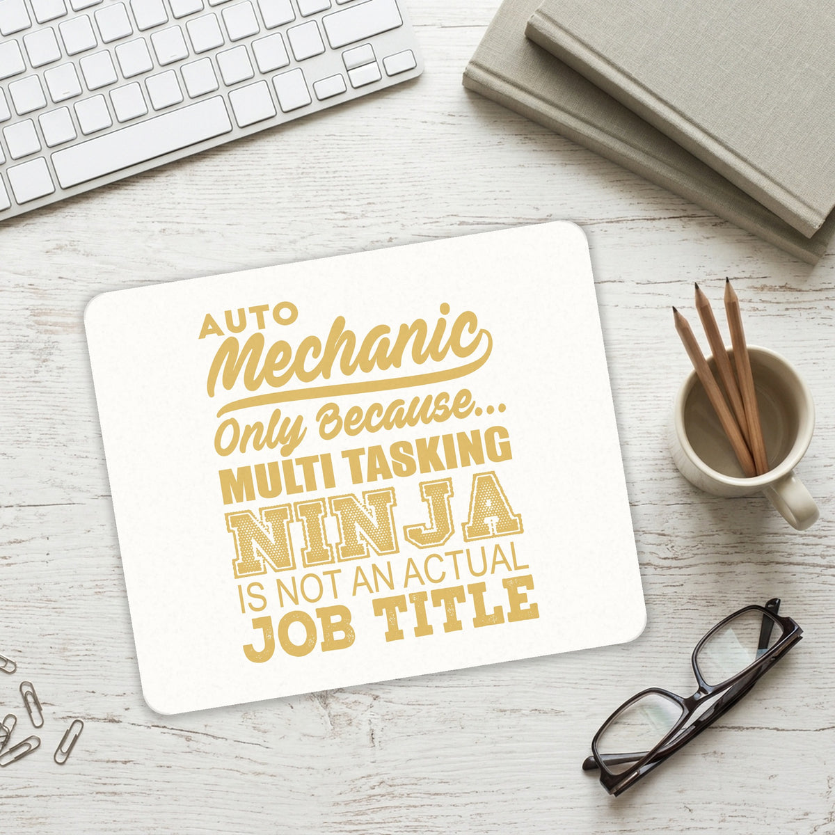 Auto Mechanic Multi Tasking Ninja mouse pad on a desk with a keyboard
