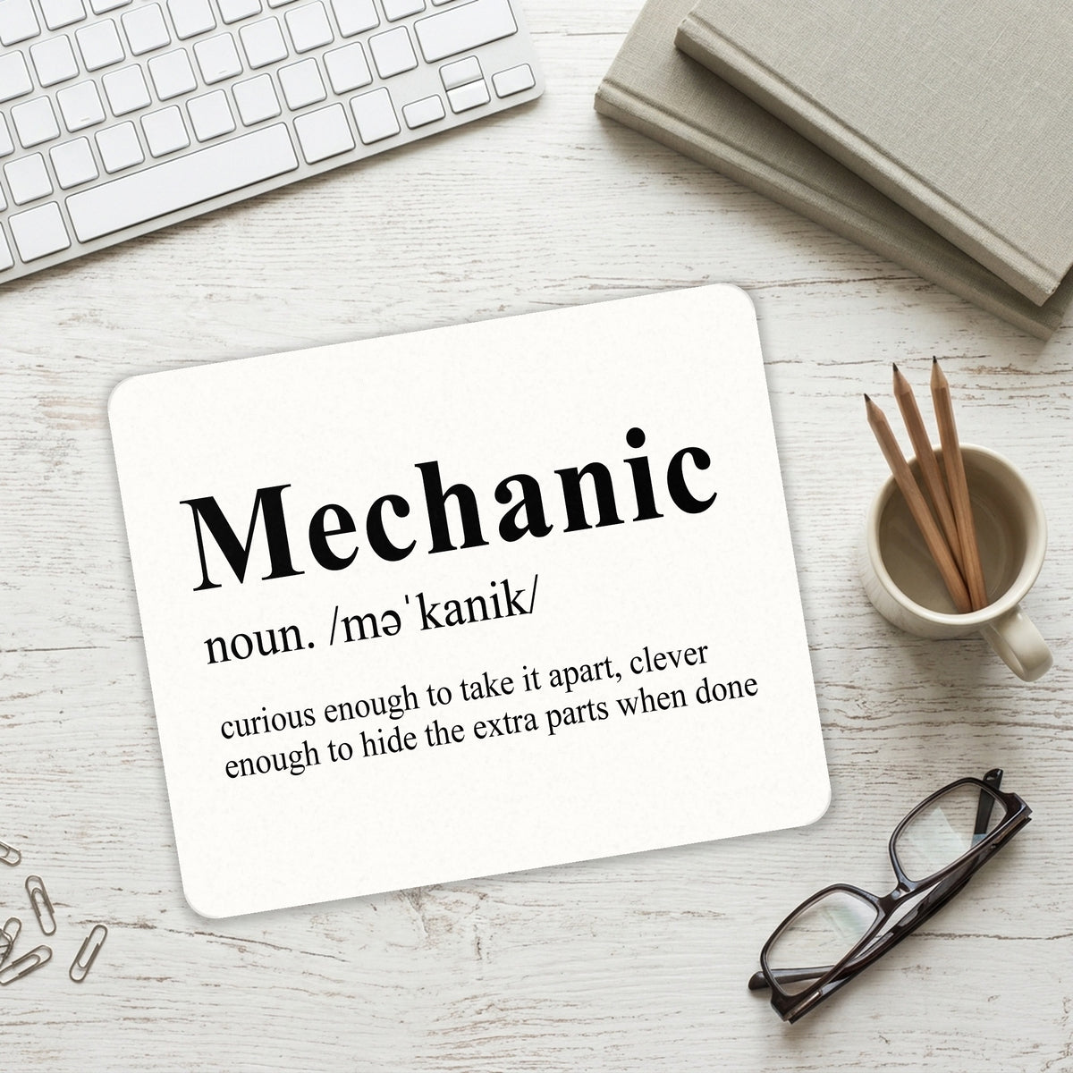 Mechanic Definition Hide the Extra Parts mouse pad on a desk with a keyboard