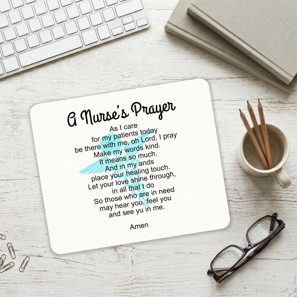A Nurse's Prayer mouse pad on a desk with a keyboard