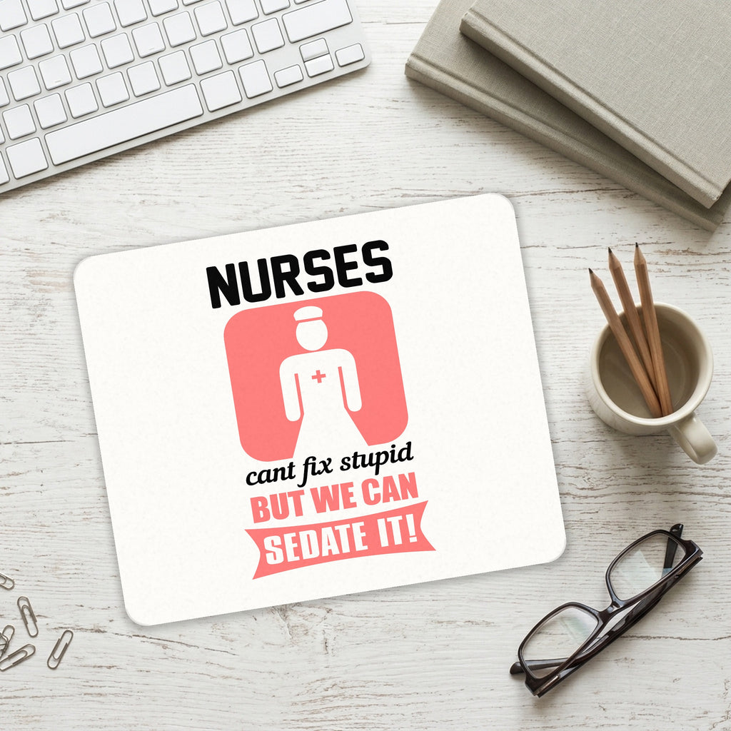 Nurses Can't Fix Stupid But Can Sedate It mouse pad on a desk with a keyboard