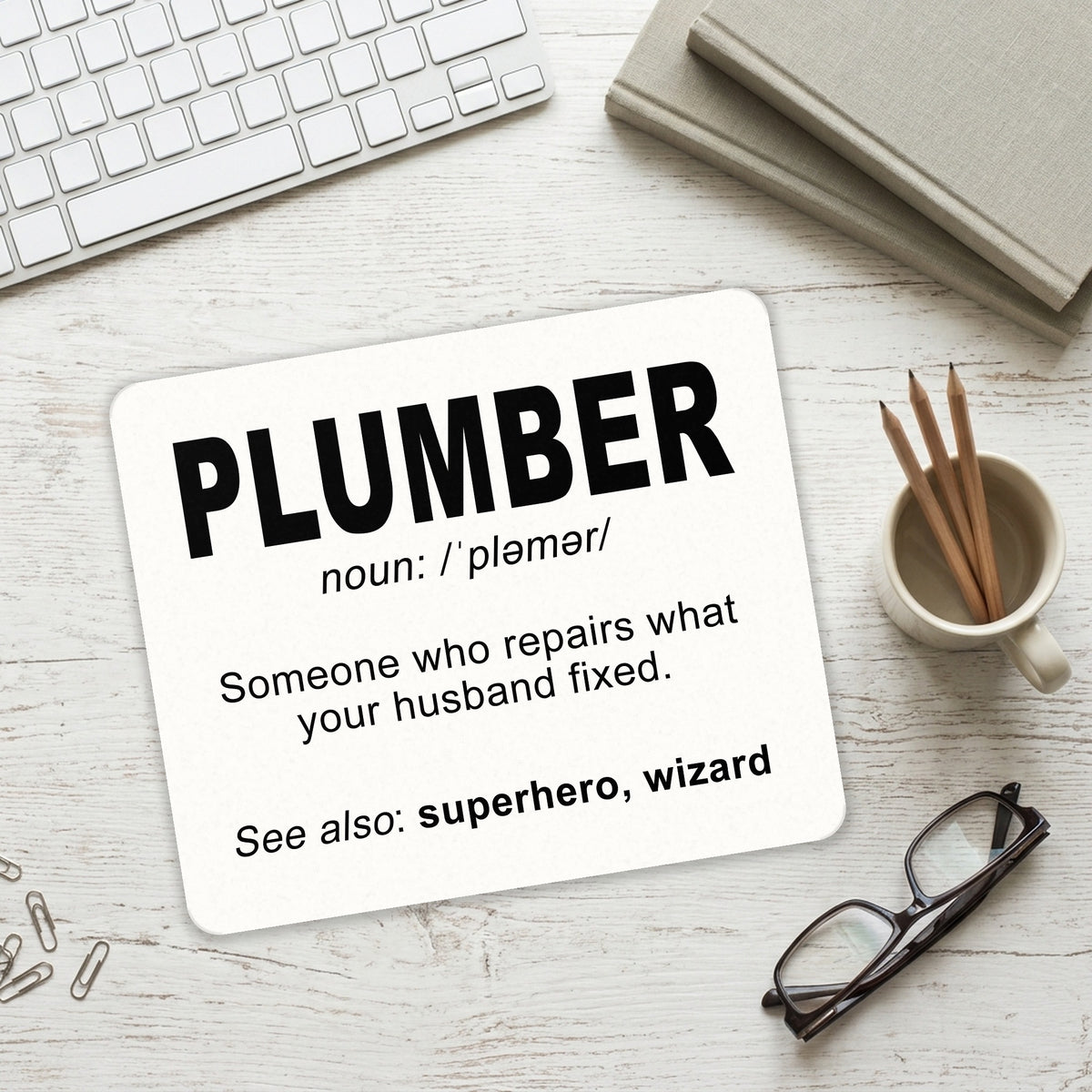 Plumber Definition - Fix What Your Husband Fixed mouse pad on a desk with a keyboard
