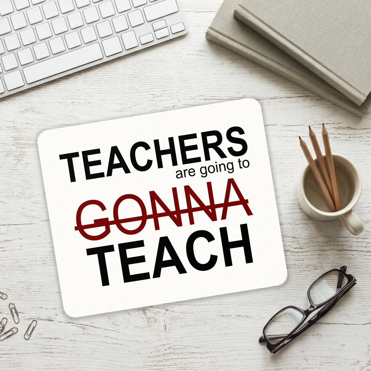 Teachers Gonna Teach mouse pad on a desk with a keyboard