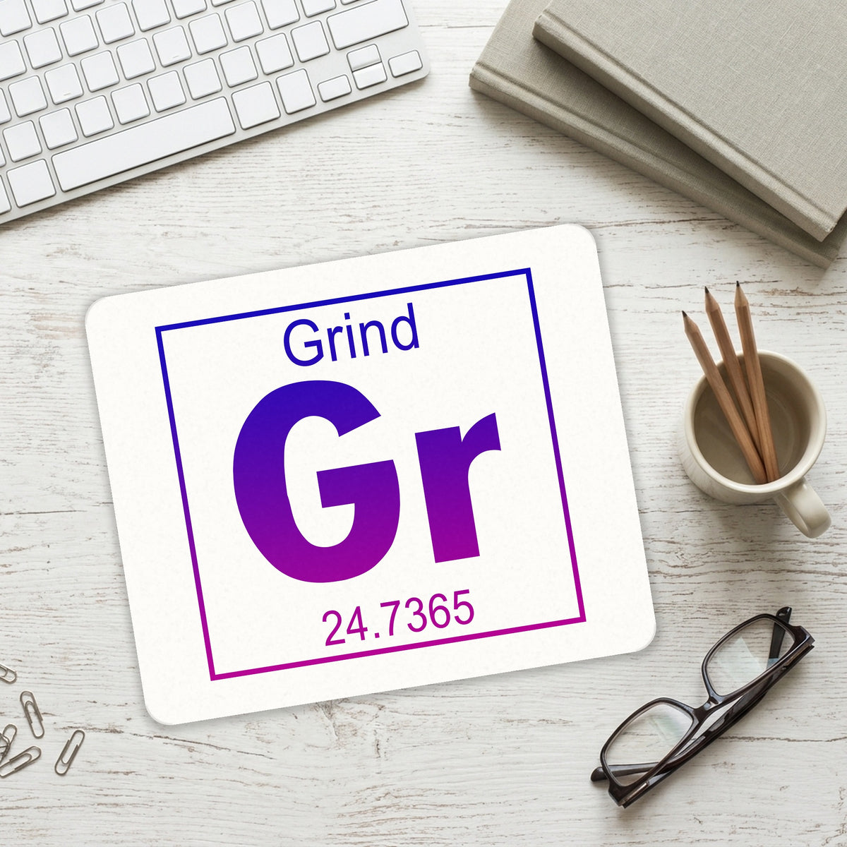 Entrepreneur Grind GR Element mouse pad on a desk with a keyboard