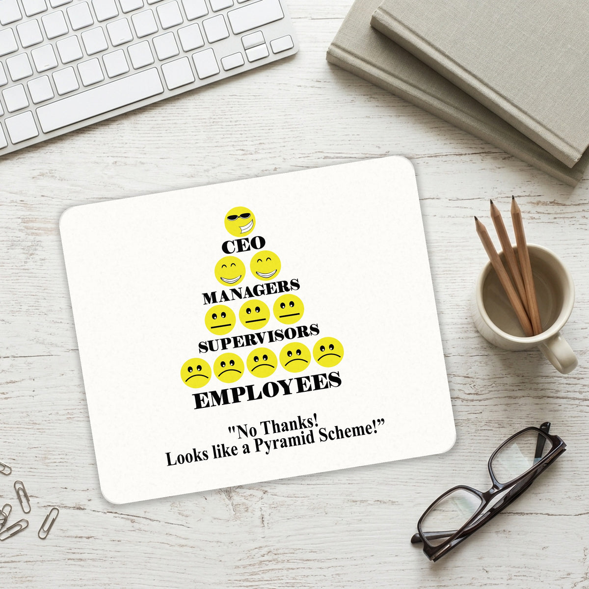 No Thanks Looks Like a Pyramid Scheme mouse pad on a desk with a keyboard