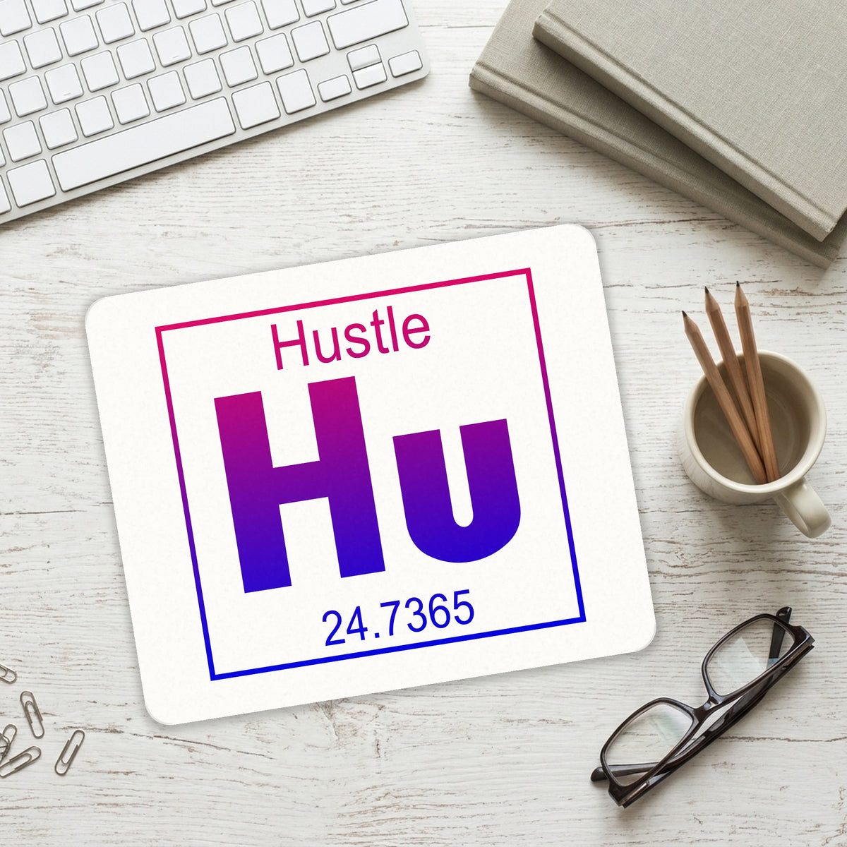 Entrepreneur Hustle Hu Element mouse pad on a desk with a keyboard