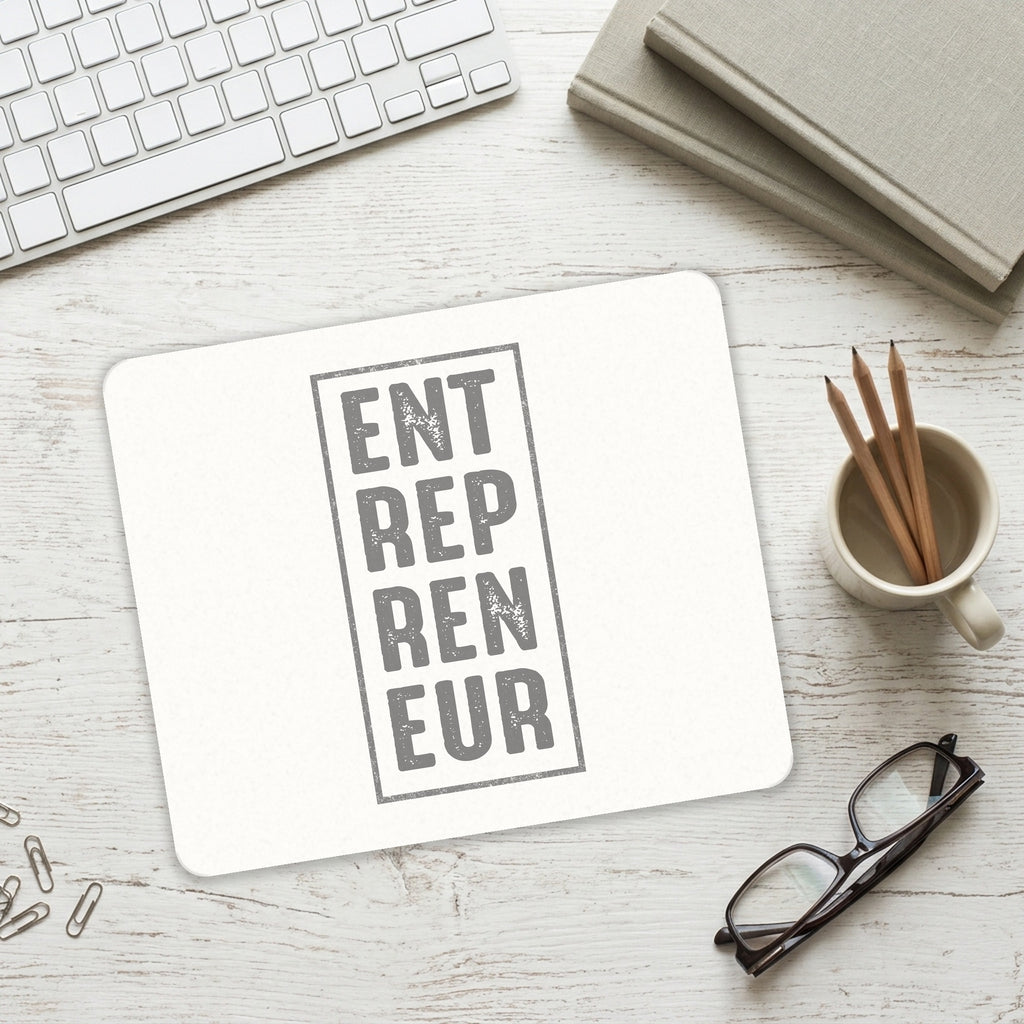Entrepreneur Word Art mouse pad on a desk with a keyboard