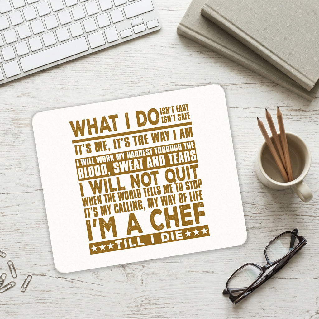 Chef - What I Do Isn't Easy mouse pad on a desk with a keyboard
