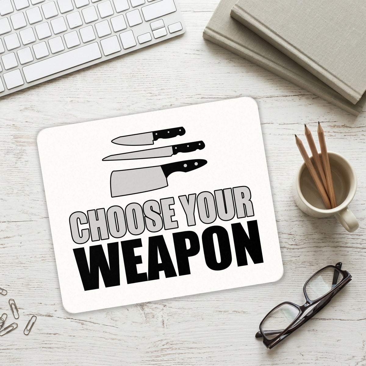 Choose Your Weapon - Chef Knives mouse pad on a desk with a keyboard
