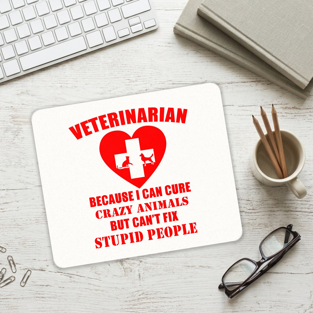 Vets Cure Crazy Animals But Can't Fix Stupid mouse pad on a desk with a keyboard