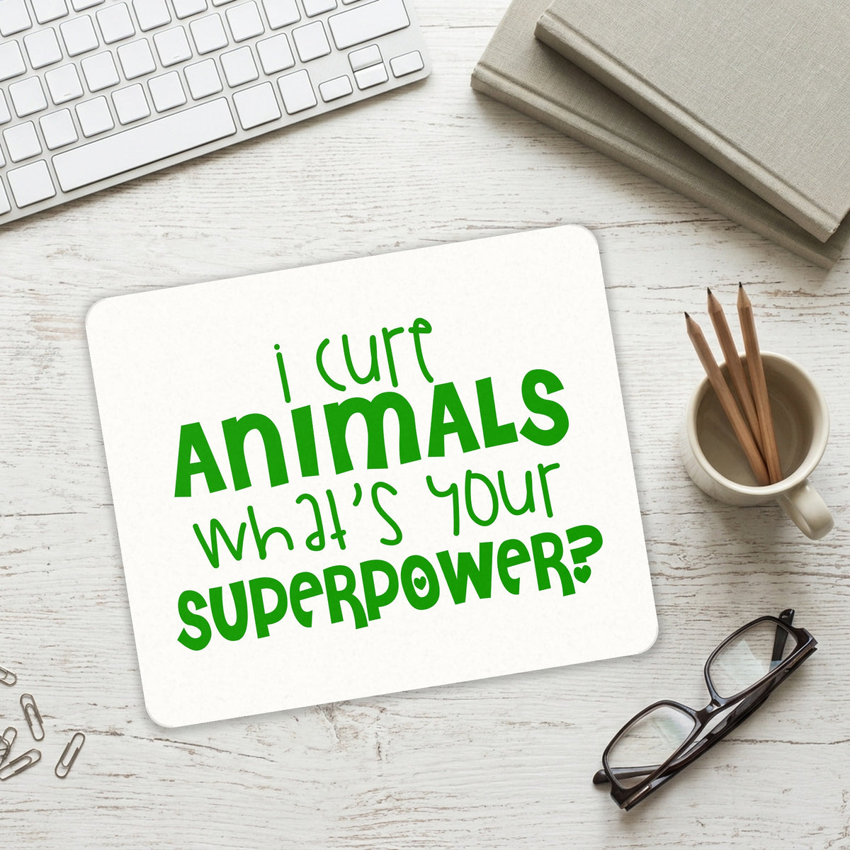 I Cure Animals What's Your Superpower mouse pad on a desk with a keyboard