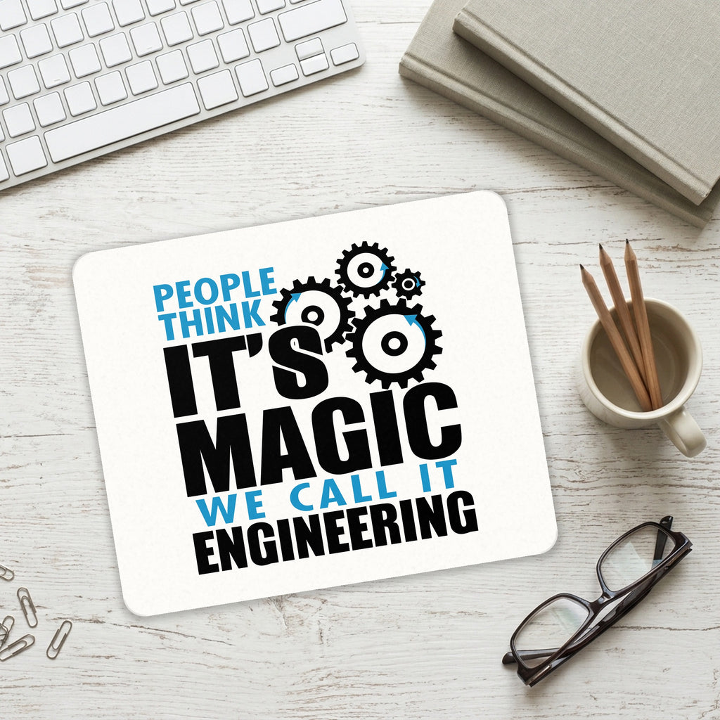 People Think It's Magic It's Engineering mouse pad on a desk with a keyboard