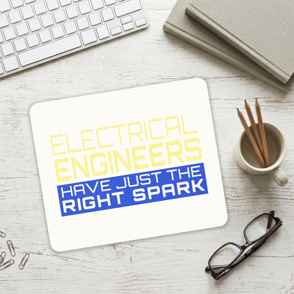 Electrical Engineers Have the Right Spark mouse pad on a desk with a keyboard
