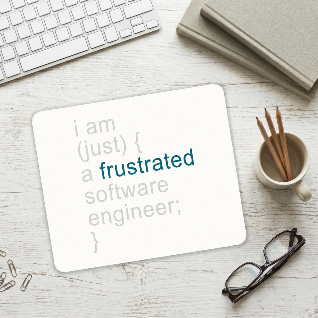 I am (just) {a frustrated software engineer;} mouse pad on a desk with a keyboard