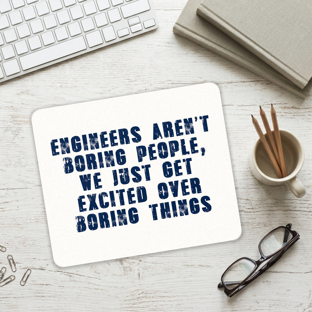 Engineers Aren't Boring Excited Over Boring Things mouse pad on a desk with a keyboard