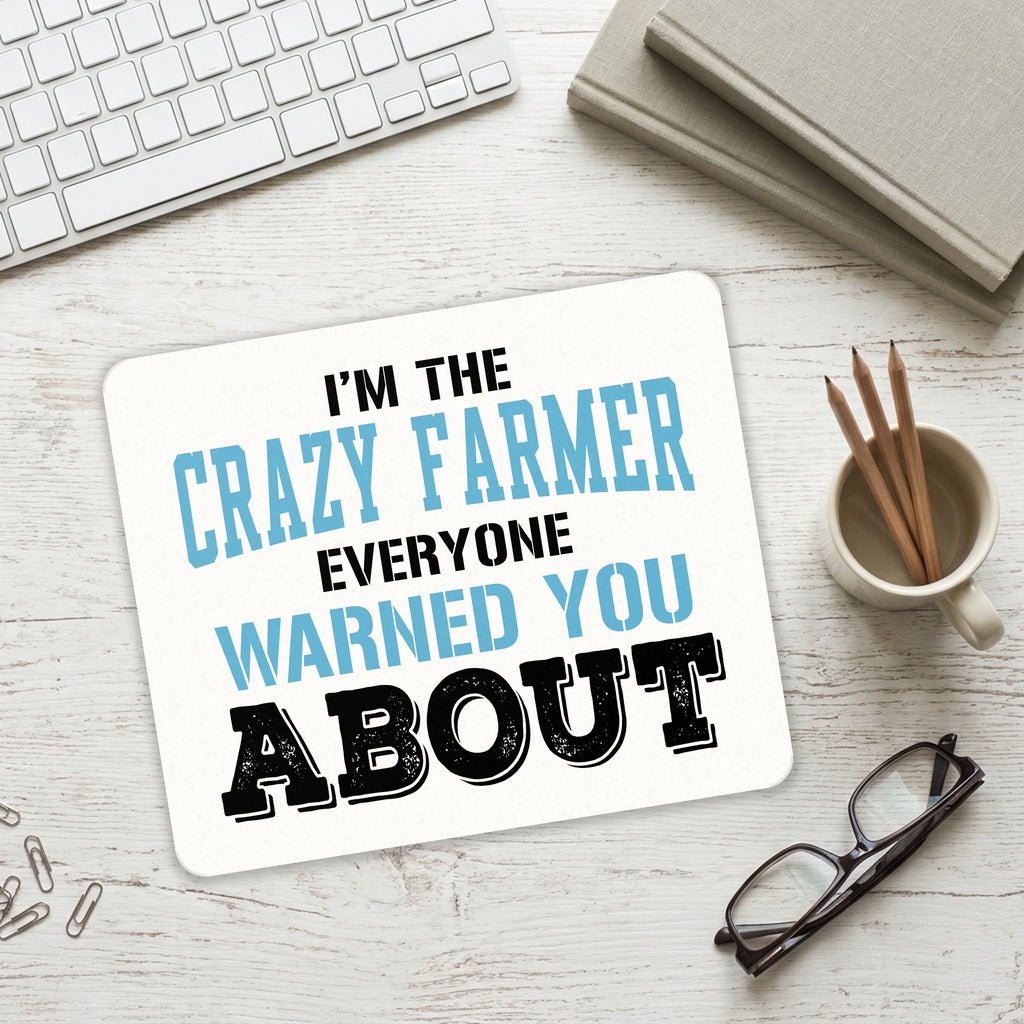 I'm The Crazy Famer Warned You About mouse pad on a desk with a keyboard