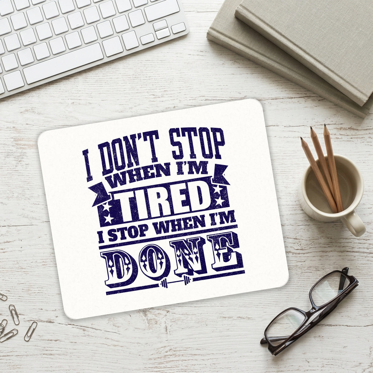 I Don't Stop When I'm Tired When I'm Done mouse pad on a desk with a keyboard