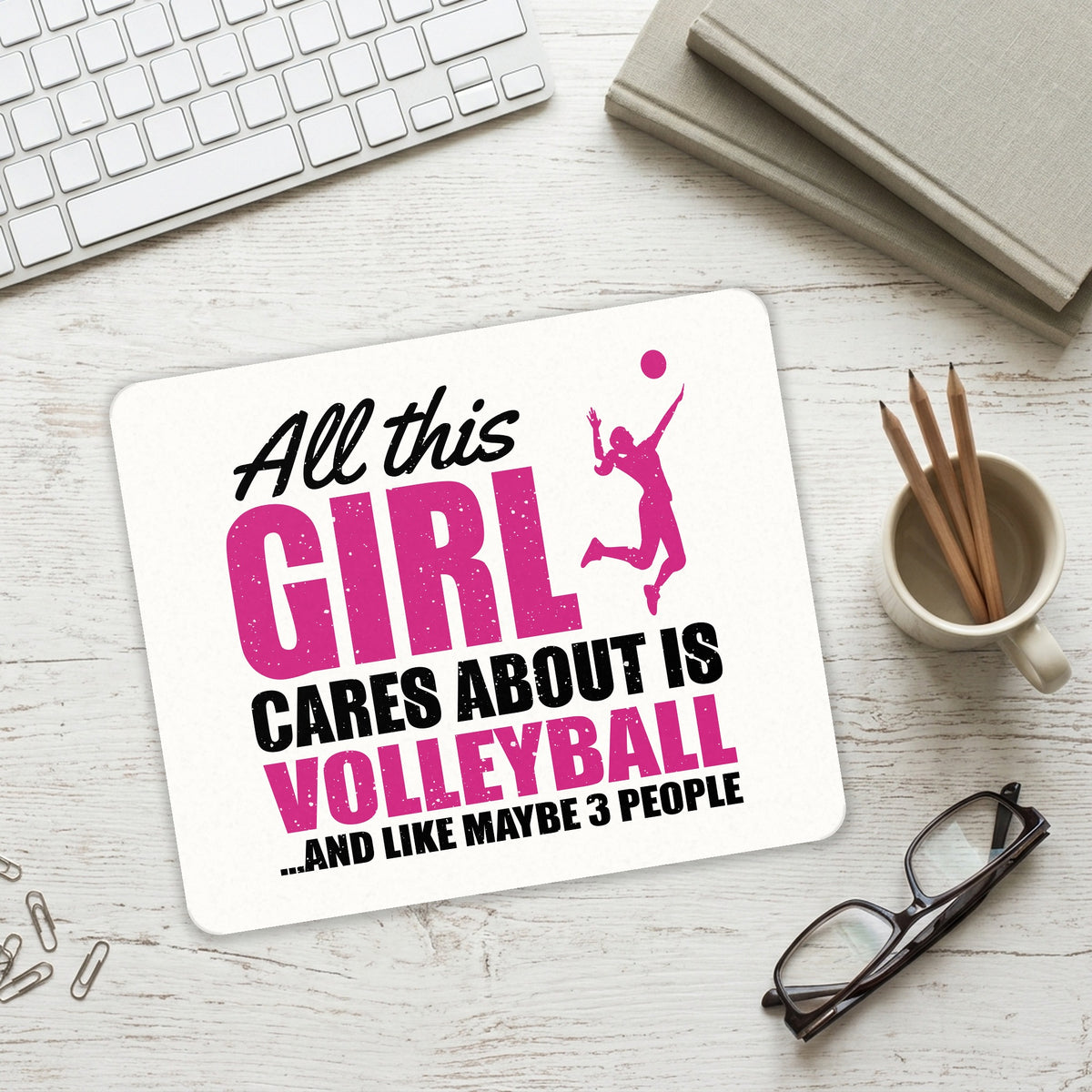 All This Girl Cares About is Volleyball mouse pad on a desk with a keyboard