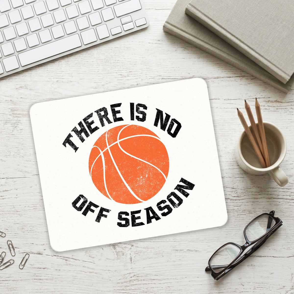 Basketball There is No Off Season mouse pad on a desk with a keyboard