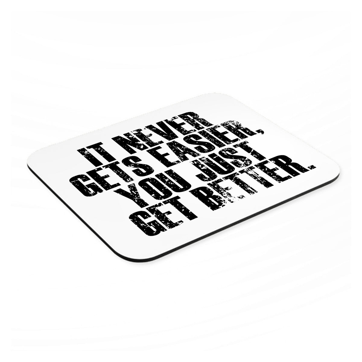 It Never Gets Easier You Just Get better mouse pad, angled view showing the 1/4 inch thick base
