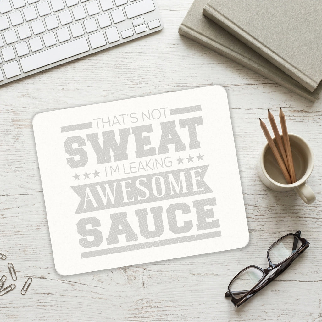 That's Not Sweat I'm Leaking Awesome Sauce mouse pad on a desk with a keyboard