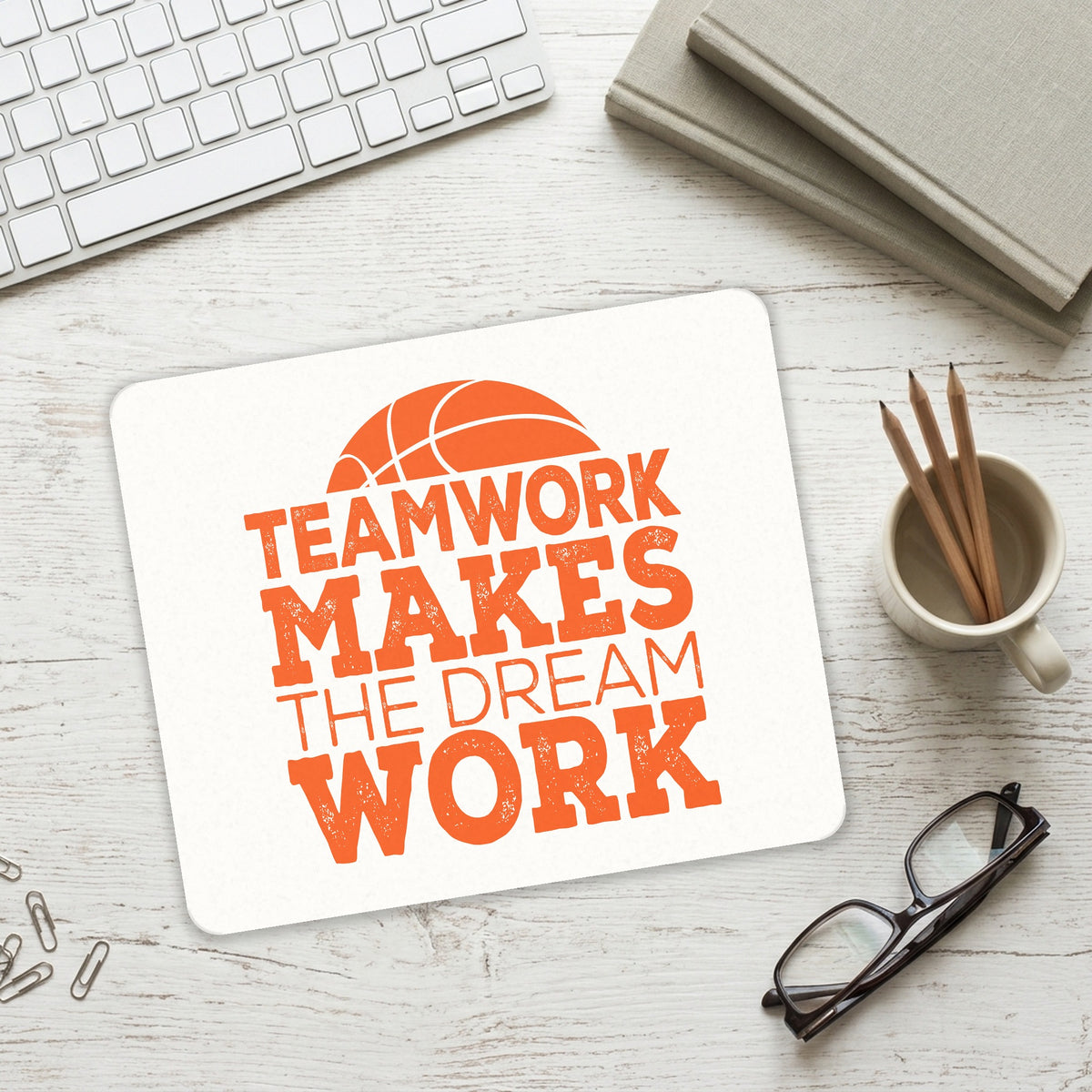 Teamwork Makes the Dream Work Basketball mouse pad on a desk with a keyboard