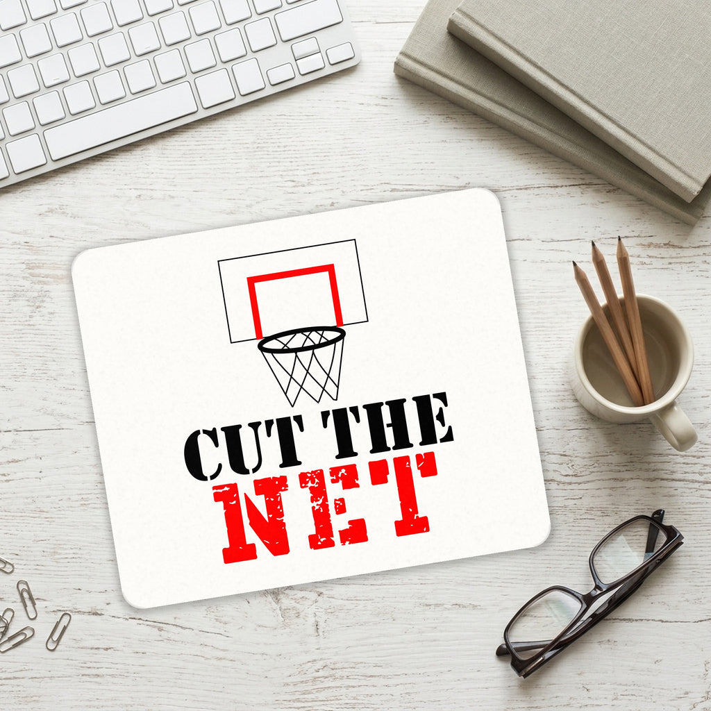 Cut the Net Basketball mouse pad on a desk with a keyboard