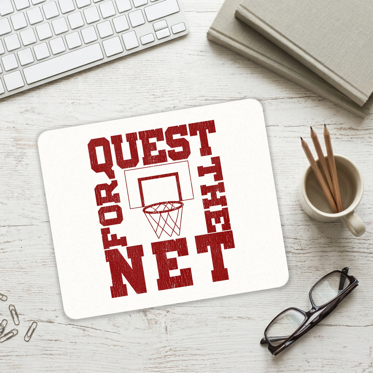 Quest For The Net Basketball mouse pad on a desk with a keyboard