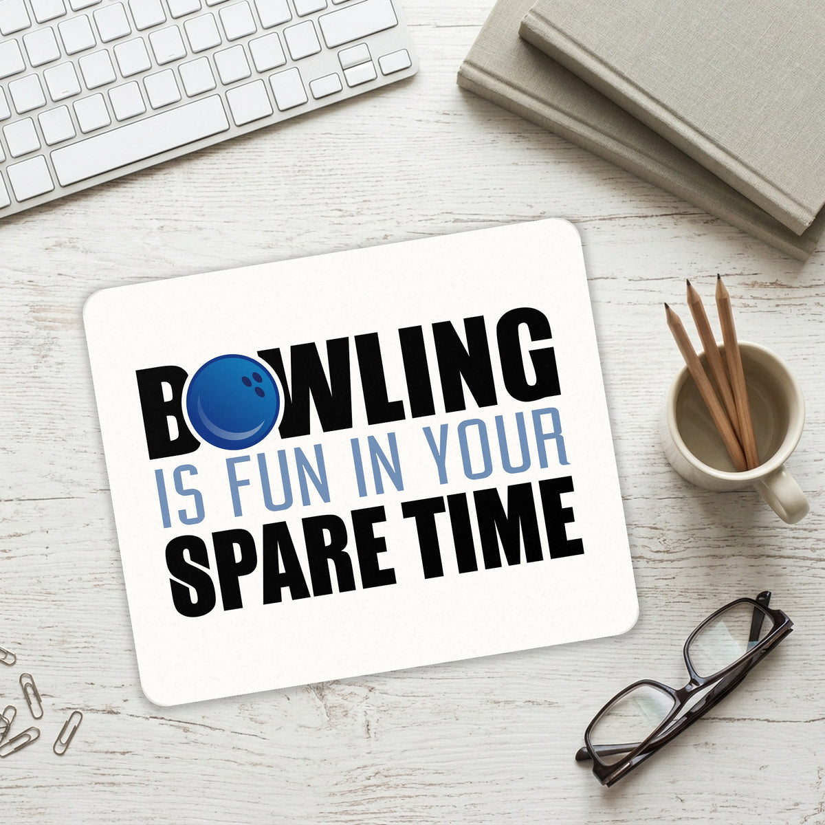 Bowling is Fun In Your SPARE Time mouse pad on a desk with a keyboard