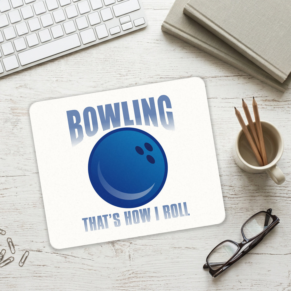 Bowling That's How I Roll mouse pad on a desk with a keyboard