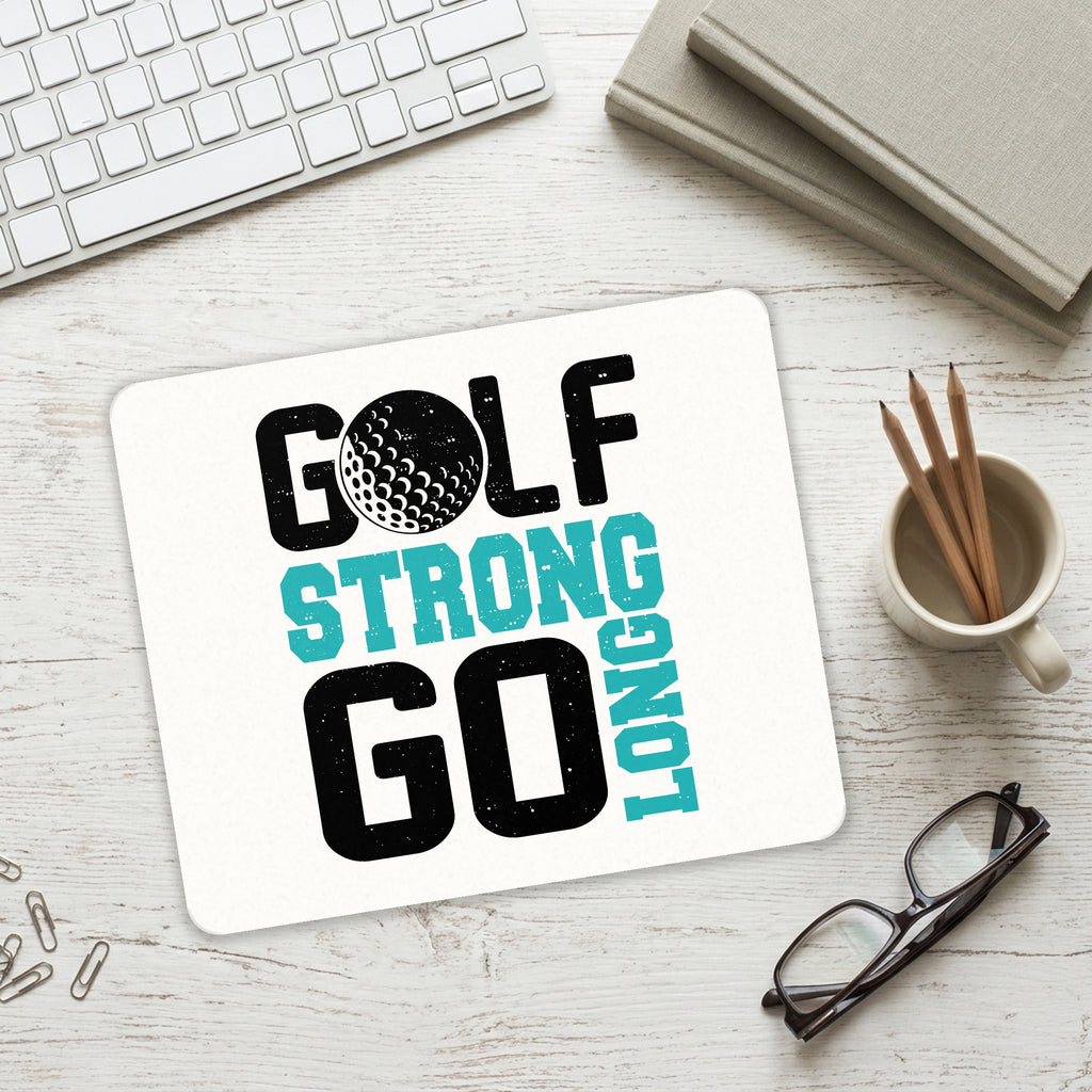 Golf Strong Go Long mouse pad on a desk with a keyboard