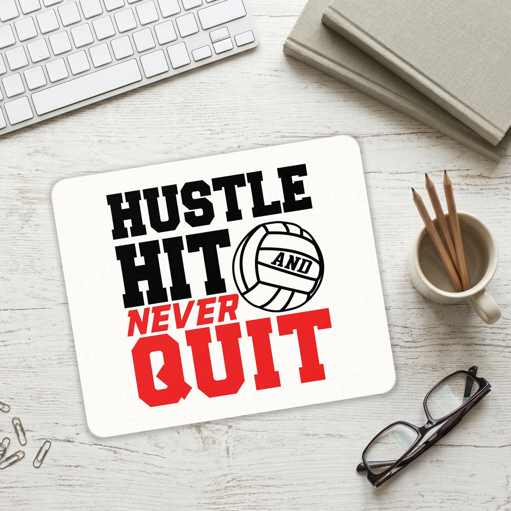 Hustle Hit Never Quit Volleyball mouse pad on a desk with a keyboard