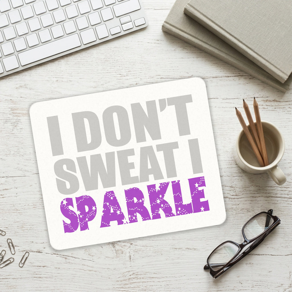 I Don't Sweat I Sparkle mouse pad on a desk with a keyboard