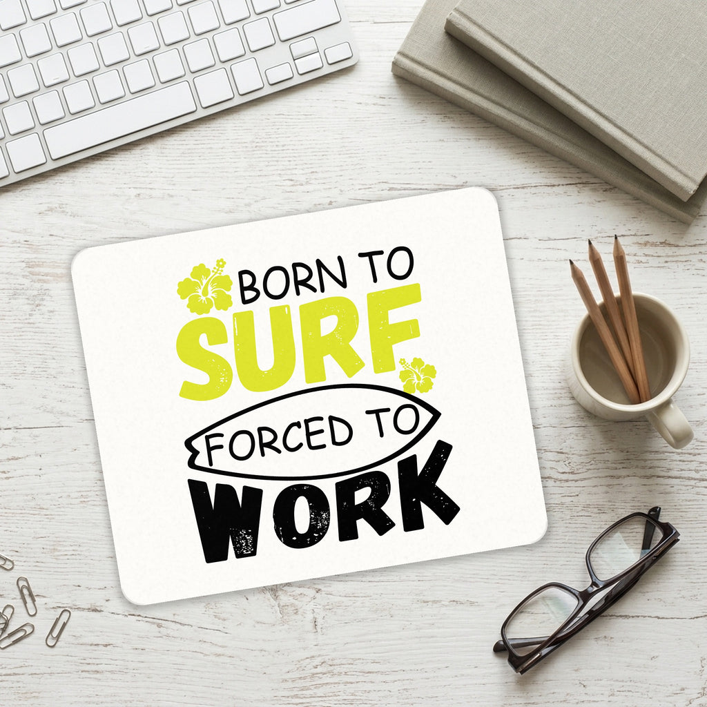 Born to Surf Forced to Work mouse pad on a desk with a keyboard