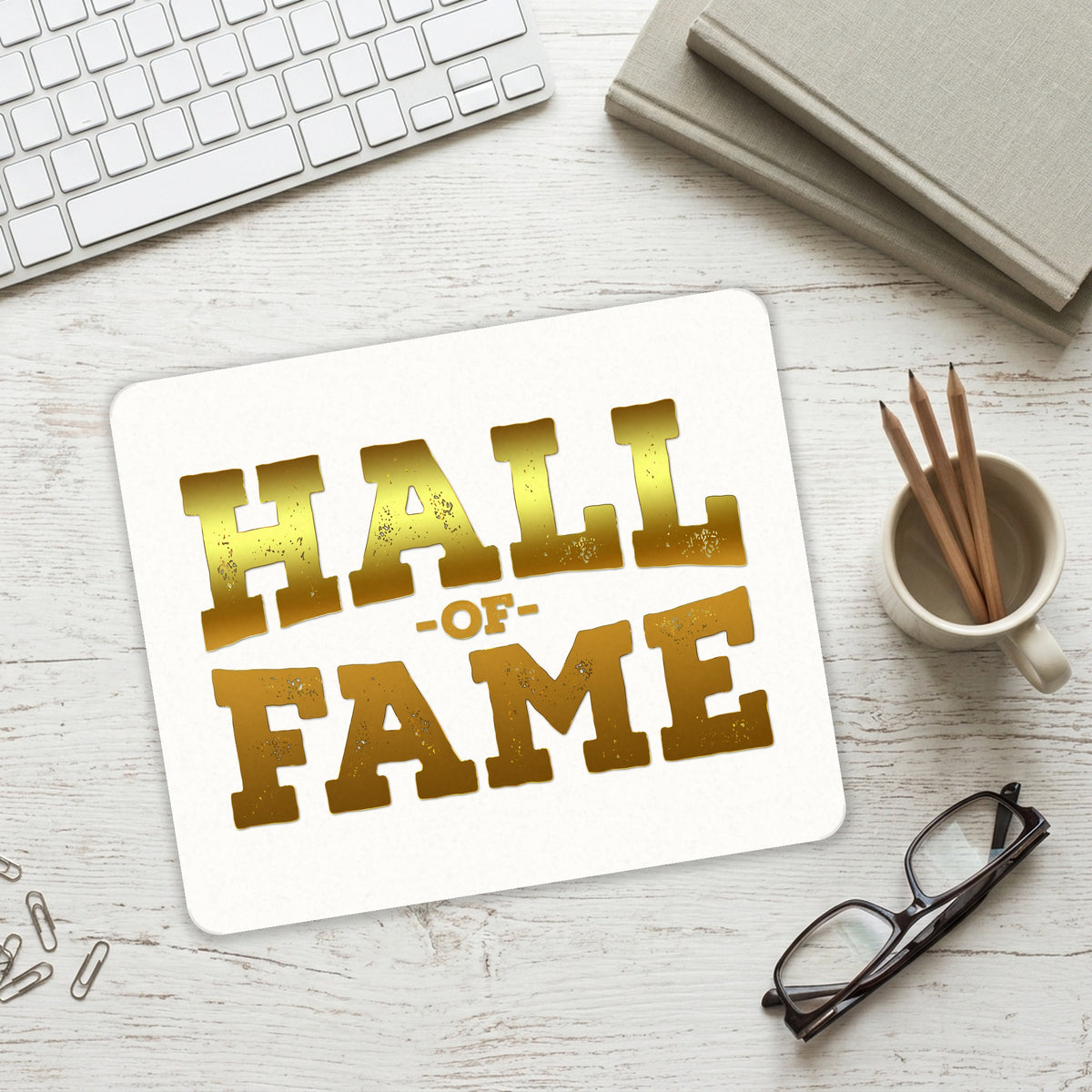 Hall of Fame mouse pad on a desk with a keyboard