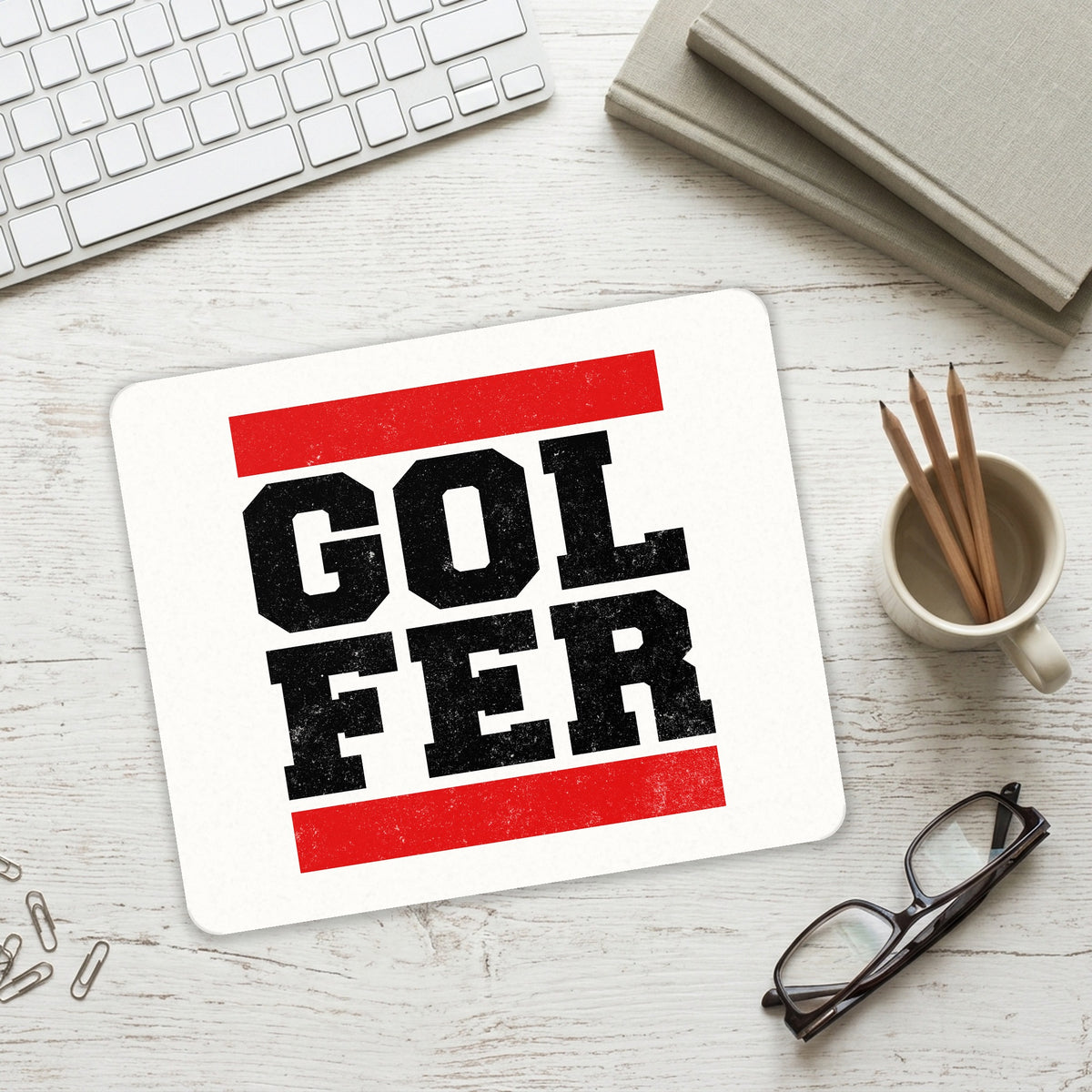 Golfer Word Art mouse pad on a desk with a keyboard