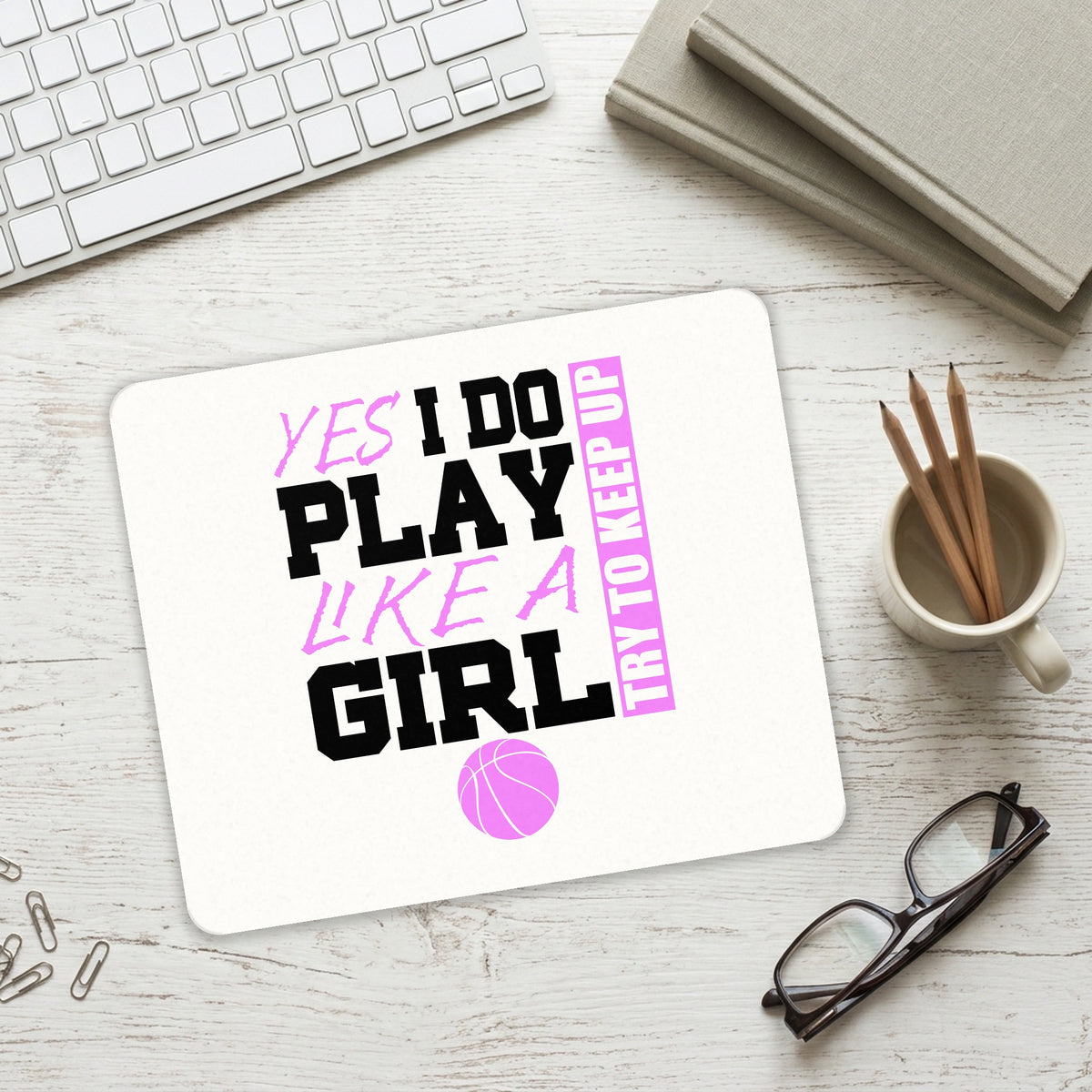Volleyball Yes I Do Play Like a Girl mouse pad on a desk with a keyboard