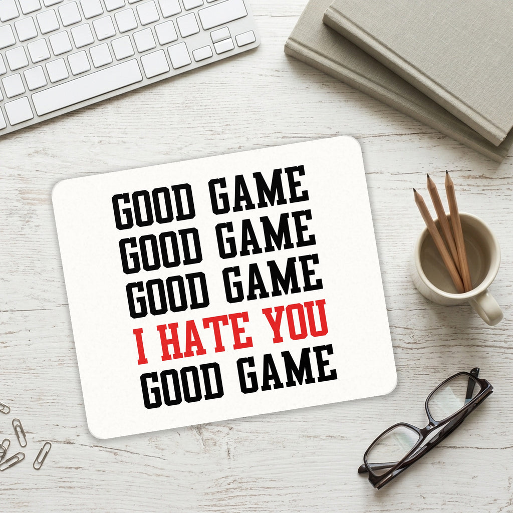 Good Game I Hate You Good Game mouse pad on a desk with a keyboard