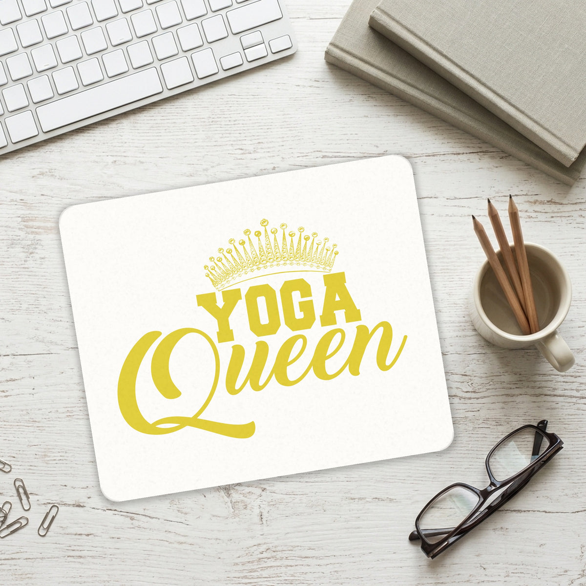 Yoga Queen Crown mouse pad on a desk with a keyboard