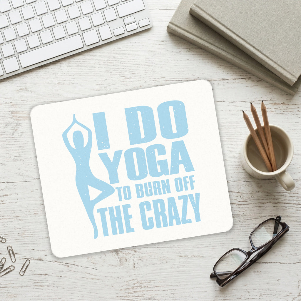 I Do Yoga to Burn Off the Crazy mouse pad on a desk with a keyboard