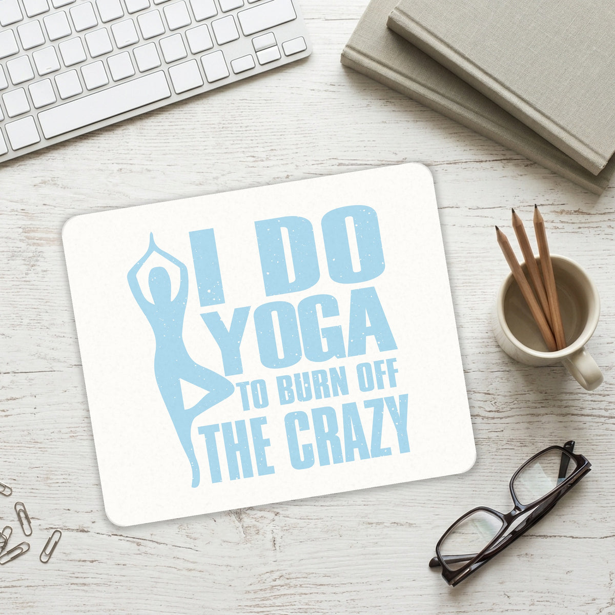 I Do Yoga to Burn Off the Crazy mouse pad on a desk with a keyboard