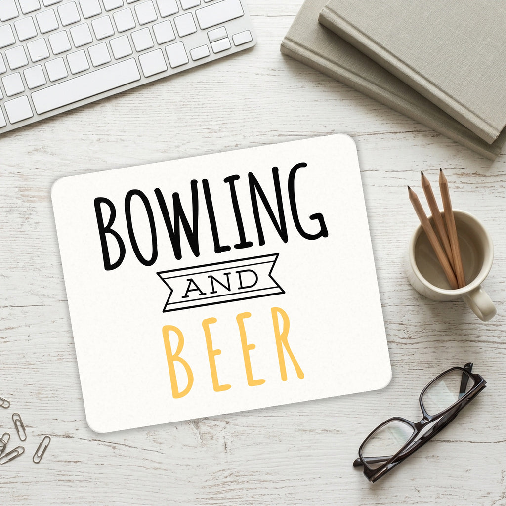 Bowling and Beer mouse pad on a desk with a keyboard