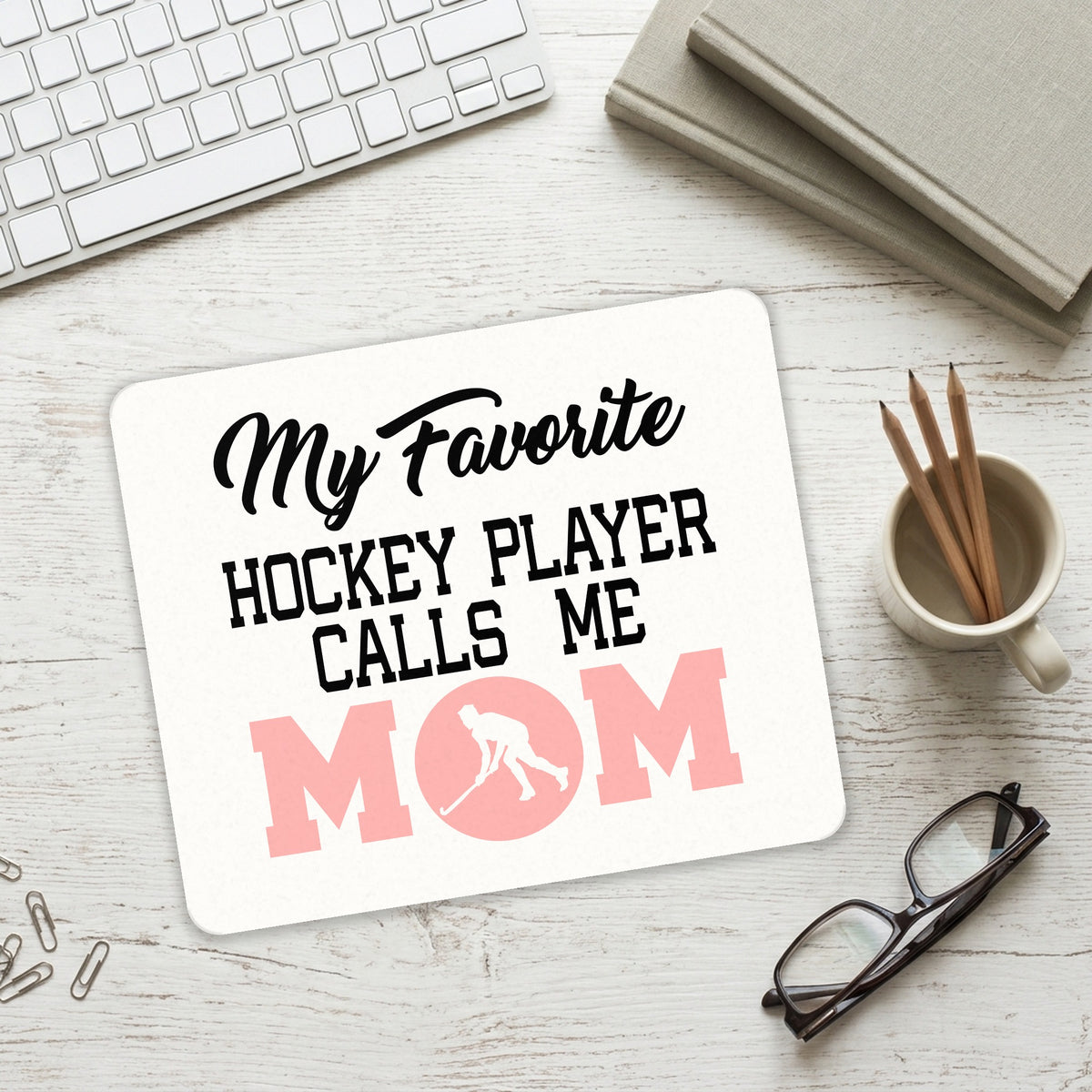 My Favorite Hockey Player Calls Me Mom mouse pad on a desk with a keyboard