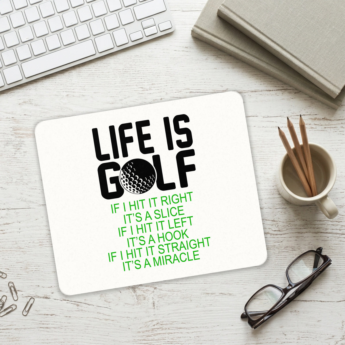 Life is Golf Slice Hook Straight Miracle mouse pad on a desk with a keyboard