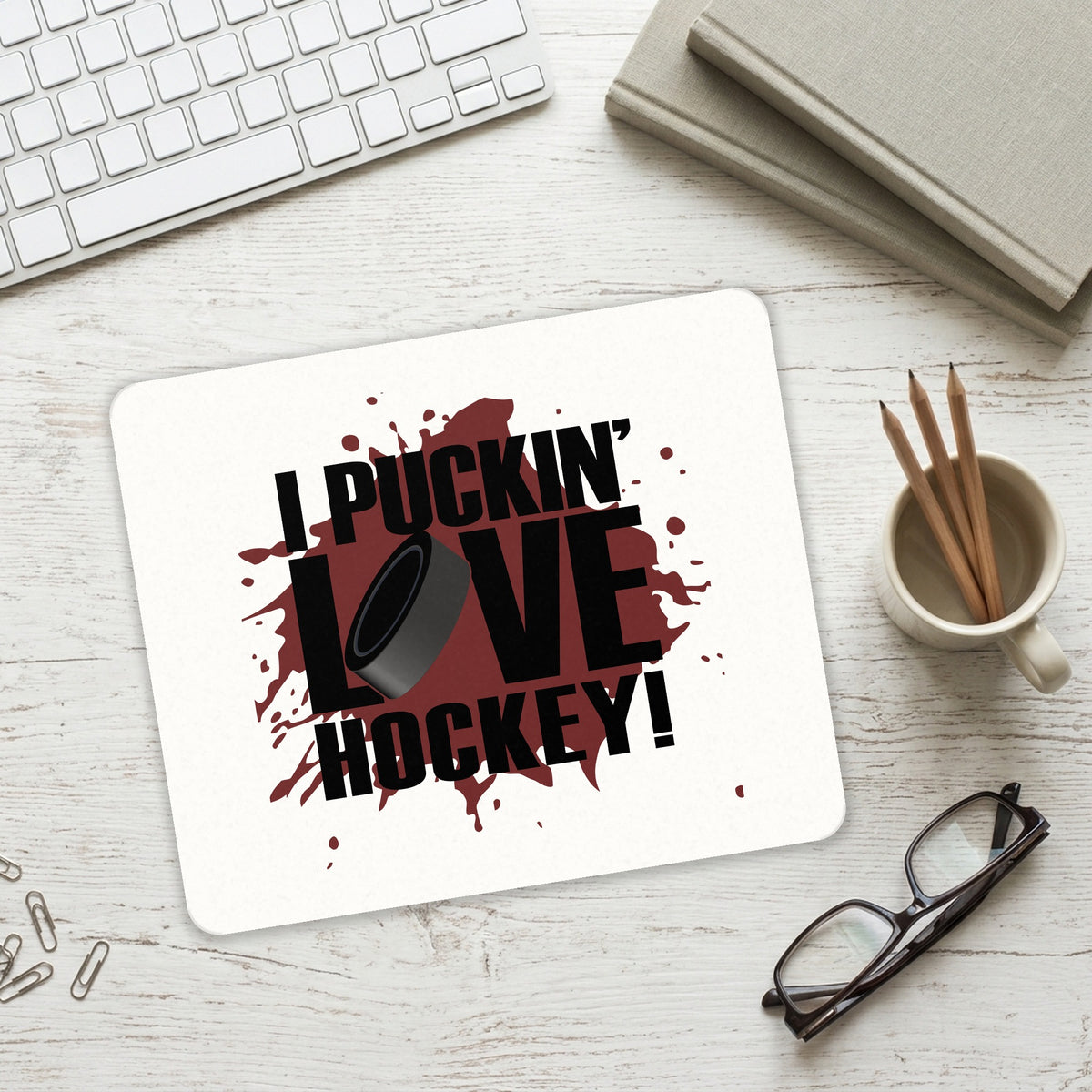 I Puckin' Love Hockey mouse pad on a desk with a keyboard