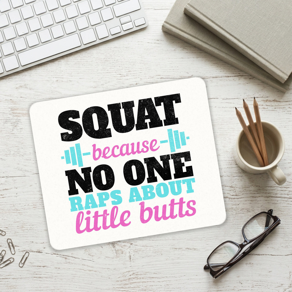 Squat Because No One Raps About Little Butts mouse pad on a desk with a keyboard
