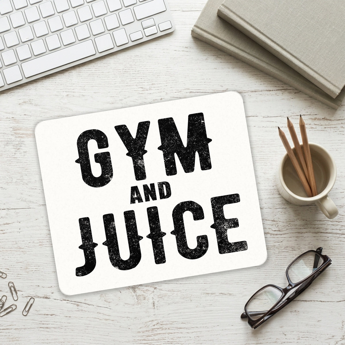 Gym And Juice mouse pad on a desk with a keyboard