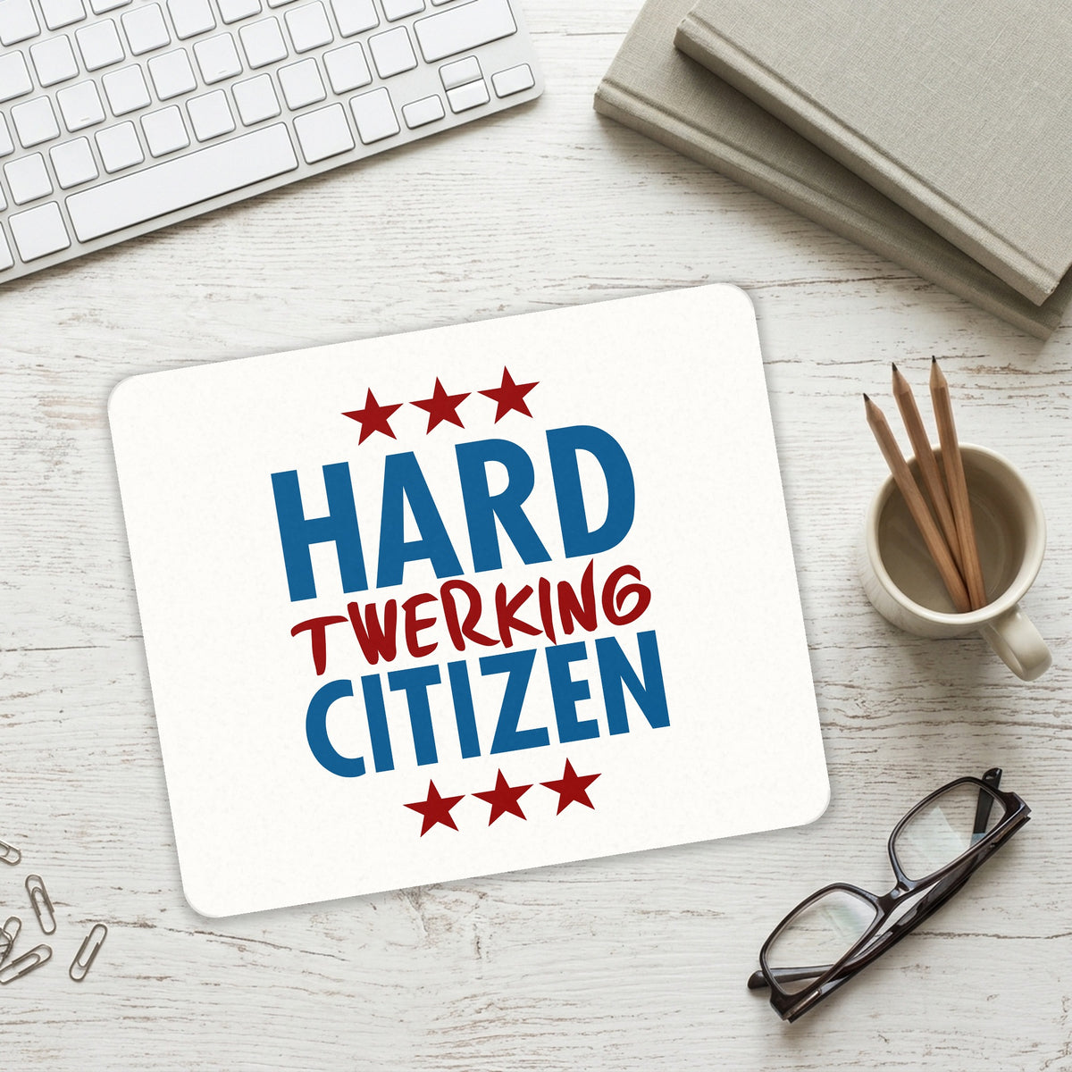 Hard Twerking Citizen mouse pad on a desk with a keyboard