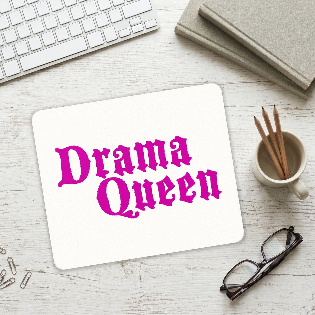 Drama Queen mouse pad on a desk with a keyboard