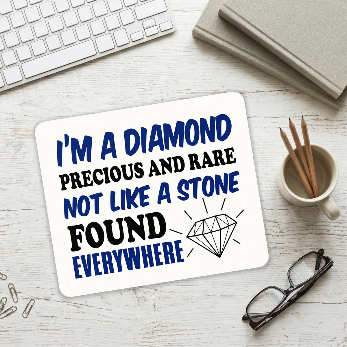 I'm a Diamond Precious Rare Not Everywhere mouse pad on a desk with a keyboard